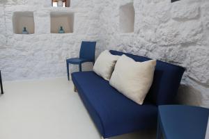 A seating area at Trullo Le Macchie