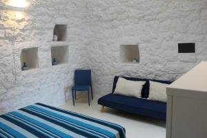 A bed or beds in a room at Trullo Le Macchie