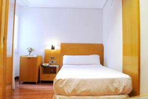 Postel nebo postele na pokoji v ubytování Hotel El Churra