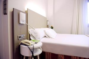 Postel nebo postele na pokoji v ubytování Hotel El Churra