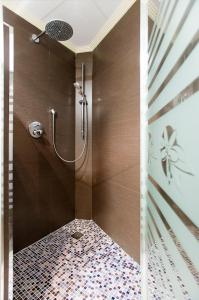 a bathroom with a shower stall and a walk in shower at Hotel El Churra in Murcia