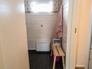 a small bathroom with a toilet and a window at Holiday Home Venuskukkula by Interhome in Äkäslompolo +3 photos