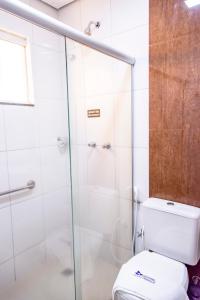 a bathroom with a shower and a toilet at Bougainville Barreiras in Barreiras +23 photos