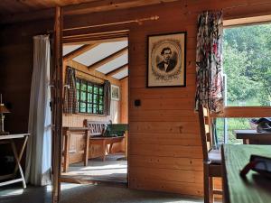 a room with a door with a picture on the wall at Ferienwohnung Schmidt - Natur und Ruhe in Schwaigen