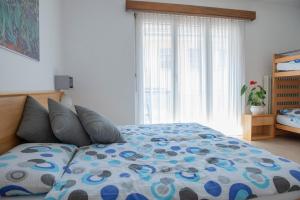 Rúm í herbergi á Garni Moderno