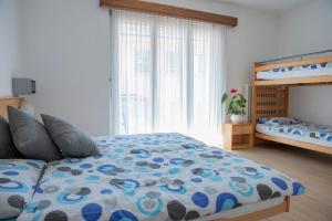 Rúm í herbergi á Garni Moderno