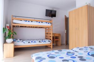Rúm í herbergi á Garni Moderno