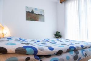 Rúm í herbergi á Garni Moderno