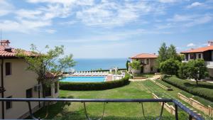 a view of the backyard of a house with a swimming pool at Вила Бел Тауър - Villa Bell Tower in Balchik