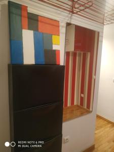 a room with a dresser and a mirror at Apartamento DH in Zamora