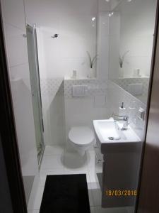 Koupelna v ubytování Apartament nad jeziorem Białym