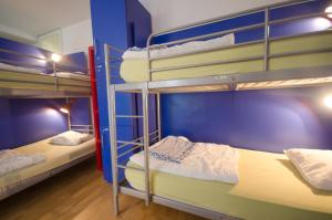 two bunk beds in a small room at H2O Hostel in Ljubljana