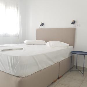 A bed or beds in a room at Marina Villa