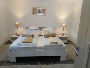 Postel nebo postele na pokoji v ubytování Koko Apartman