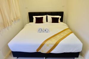Postel nebo postele na pokoji v ubytování Vamin Resort Chiangkhan Loei วามินทร์รีสอร์ท เชียงคาน เลย