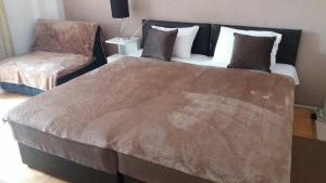 Postel nebo postele na pokoji v ubytování Liberta Apartment