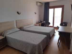 Postel nebo postele na pokoji v ubytování Hotel Condestable