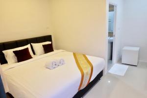 Postel nebo postele na pokoji v ubytování Vamin Resort Chiangkhan Loei วามินทร์รีสอร์ท เชียงคาน เลย