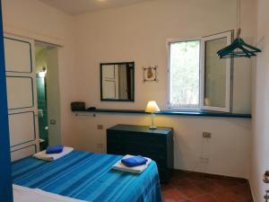 Ένα ή περισσότερα κρεβάτια σε δωμάτιο στο B&B Vacanza Facile