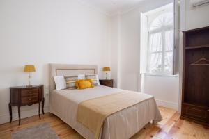 Uma cama ou camas num quarto em Casa D'Oliveira