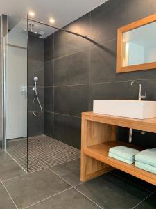 a bathroom with a sink and a shower at Relax & Spa - Séjour Romantique in Margny-lès-Compiègne