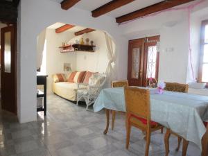 a living room with a table and a couch at Ustrine view in Ustrine