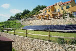 a group of solar panels on a stone wall at Agriturismo Zenestrin in Orco Feglino