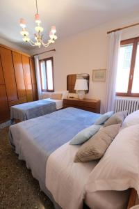 A bed or beds in a room at Venice Life