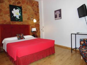 Cama o camas de una habitación en Casa Rural Jardín del Desierto