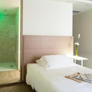 Voodi või voodid majutusasutuse Hotel Marelet toas