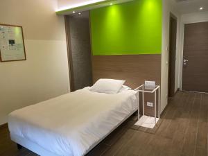 Voodi või voodid majutusasutuse Hotel Marelet toas