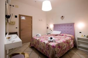 Postel nebo postele na pokoji v ubytování Hotel Caraibi
