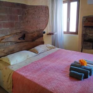 En eller flere senger på et rom på Casa Giulia on Francigena