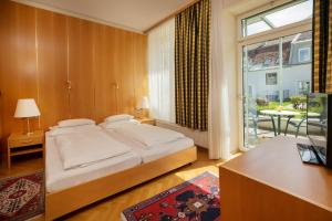 Letto o letti in una camera di Hotel Gollner