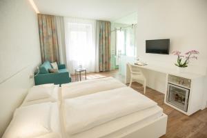 Letto o letti in una camera di Hotel Gollner