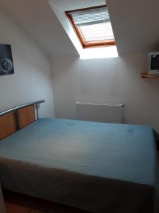 Posteľ alebo postele v izbe v ubytovaní Jozefin apartman