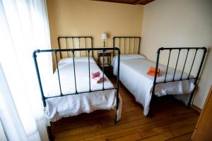 Postel nebo postele na pokoji v ubytování Casiña de Meyre