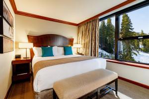 a bedroom with a bed and a window at Resort at Squaw Creek, a Destination by Hyatt Residence in Olympic Valley