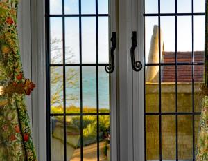 an open window with a view of the ocean at Haven Hall Hotel in Shanklin