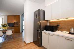Kuchyň nebo kuchyňský kout v ubytování Residenza Alba - Molveno