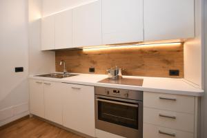 Kuchyň nebo kuchyňský kout v ubytování Residenza Alba - Molveno