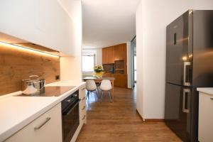 Kuchyň nebo kuchyňský kout v ubytování Residenza Alba - Molveno