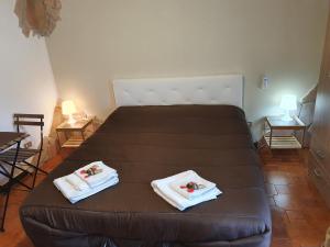Кровать или кровати в номере Via CASALE