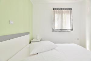 Postel nebo postele na pokoji v ubytování Villa Dvori