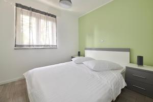 Postel nebo postele na pokoji v ubytování Villa Dvori