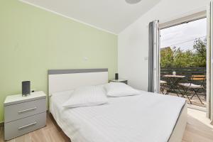 Postel nebo postele na pokoji v ubytování Villa Dvori