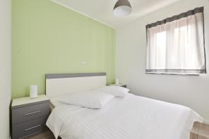 Postel nebo postele na pokoji v ubytování Villa Dvori