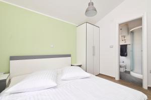 Postel nebo postele na pokoji v ubytování Villa Dvori