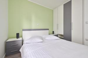 Postel nebo postele na pokoji v ubytování Villa Dvori