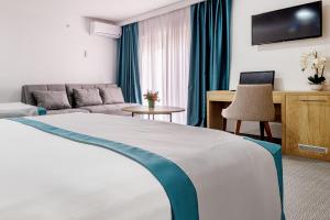Postel nebo postele na pokoji v ubytování Hotel Porat